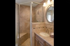 Mystera Solid Surface Shower Walls, Vanity Top and Sink in a Residential Bathroom