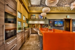 Avonite Studio Collection Amber Glass and New Cauldron Solid Surface Countertops in a Residential Kitchen