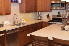Residential Kitchen Counter and Island of Solid Surface with Undermount Stainless Steel Sink. DIY Created.