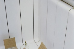 Corian White Solid Surface Thermoformed Exterior Cladding in a Hotel Guest Area