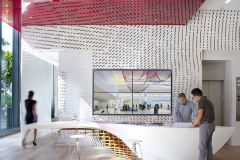 LG HI-MACS Alpine White Solid Surface Sculptured Wall and Thermoformed Reception Desk in a Reception Area