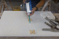 Solid Surface Fabricator Applying Adhesive to a Joint Seam