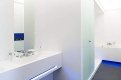 LG HI-MACS Alpine White Solid Surface Shower with Bath Walls and Vanitytop of the same.