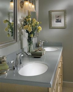 Design a Corian® custom solid surface vanity top with dual sinks.