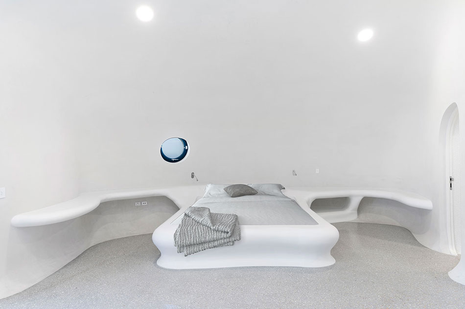 Curved bed surround in Glacier White Corian®  Courtesy of Rezolution Photography 