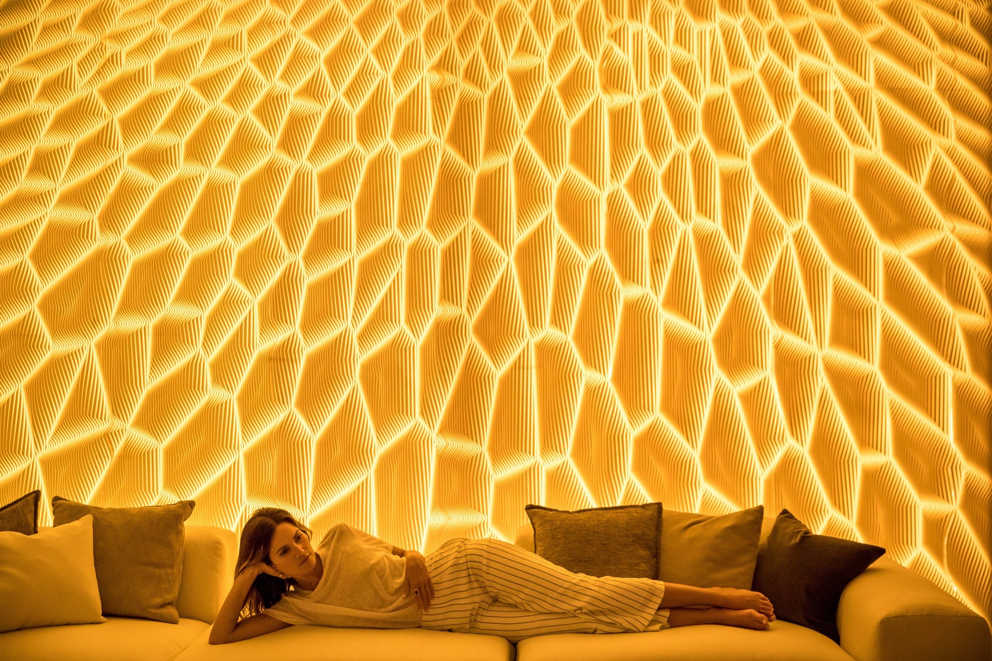 Corian® Design showcased these multi-dimensional wall systems, by designer Mario Romano, that looked as if they were carved. ("HONEY," photography courtesy of Mario Romano.)