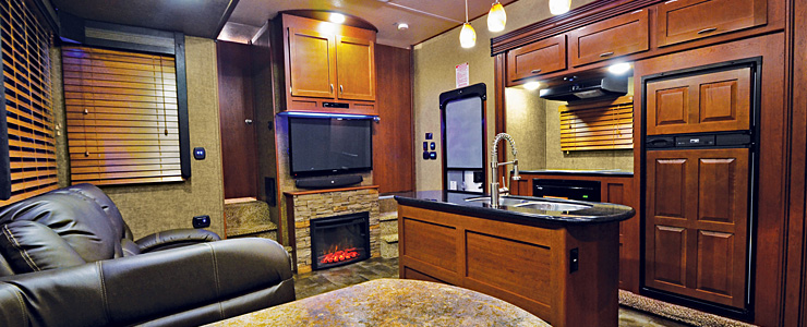 Wood cabinets with solid surface countertops in a recreational vehicle.
